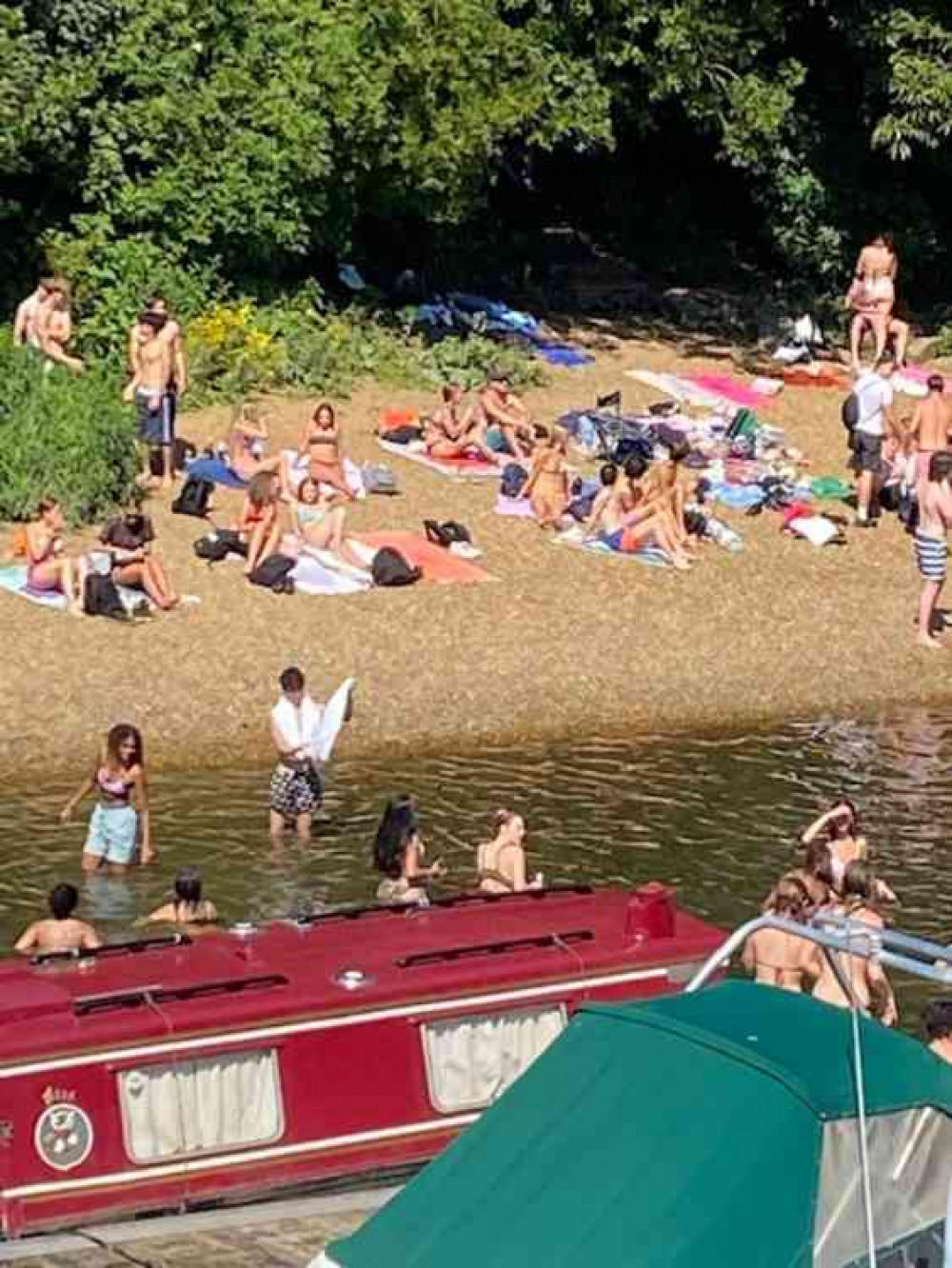 Scores of sunbathers crammed on to the small area