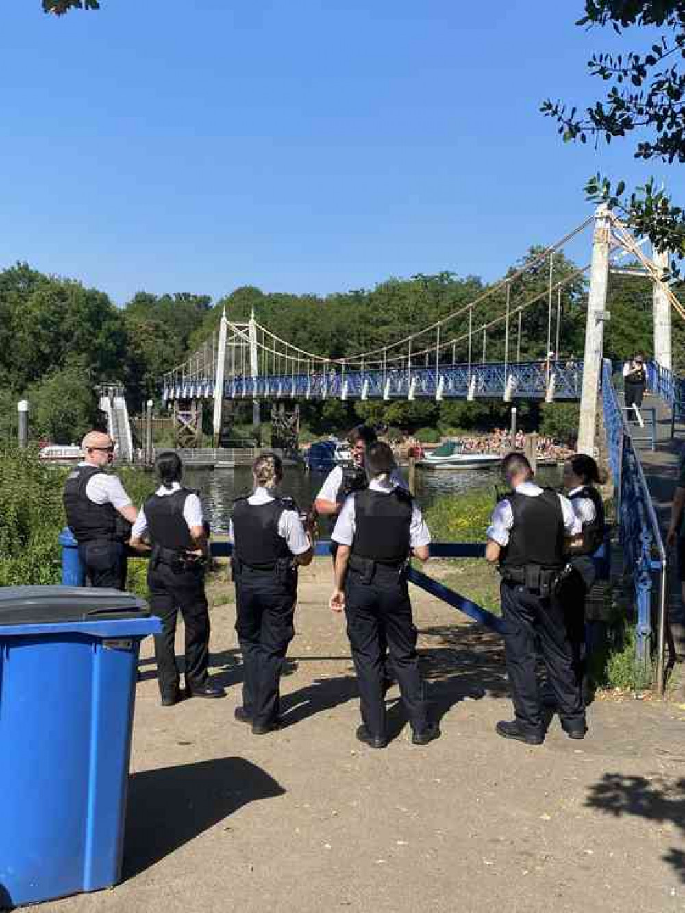 Police await instructions before moving on to the bridge to disperse youngsters