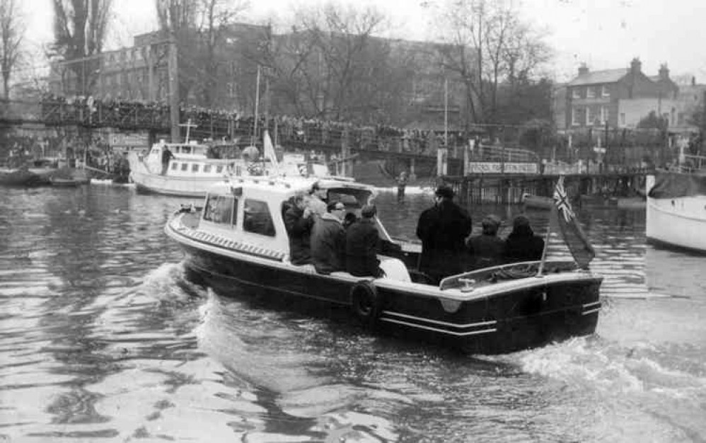 Screaming fans jam Teddington Lock footbridge to see The Beatles arrive at Teddington Studios in February 1964