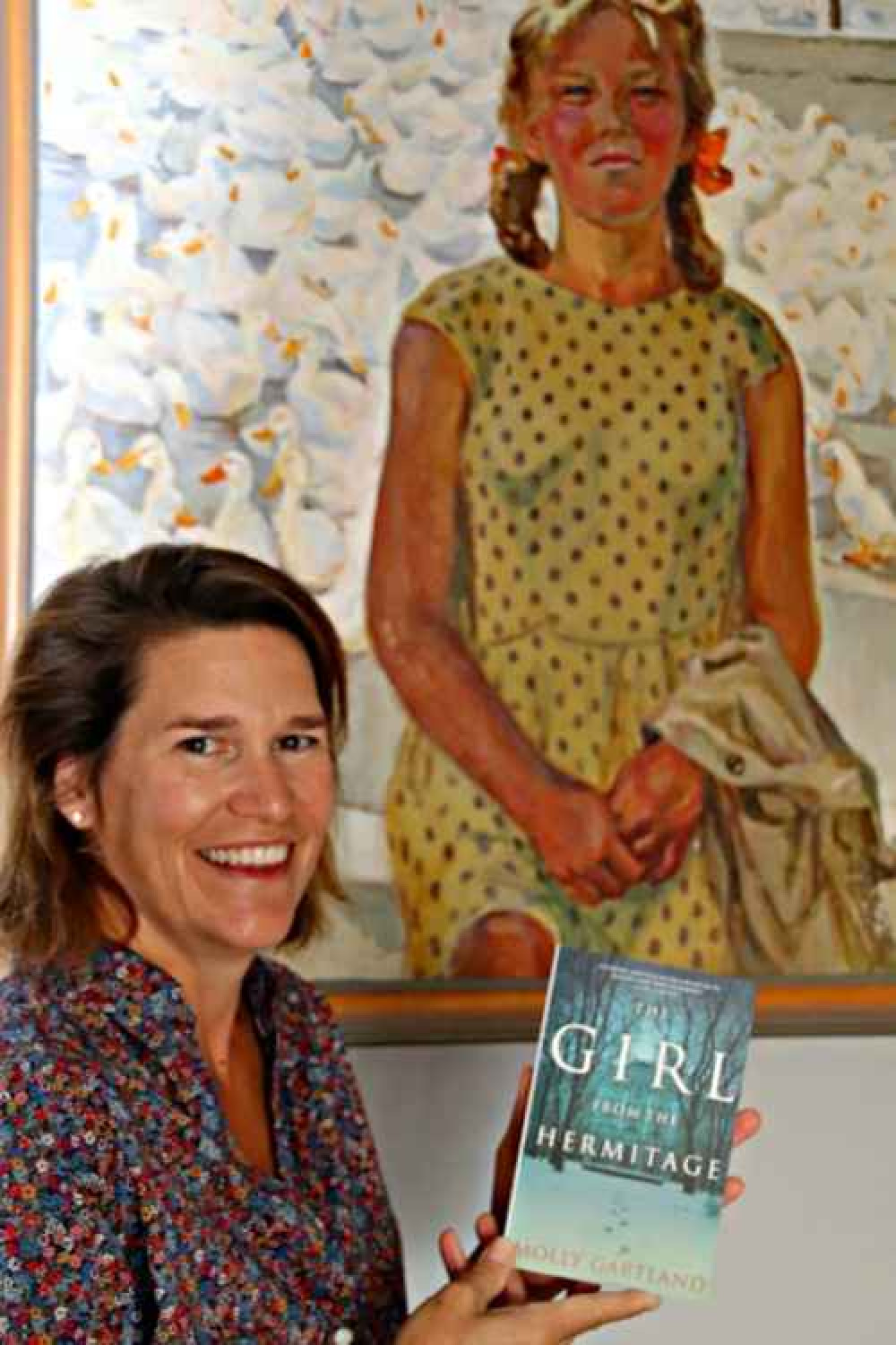 Molly Gartlan with the portrait that inspired her