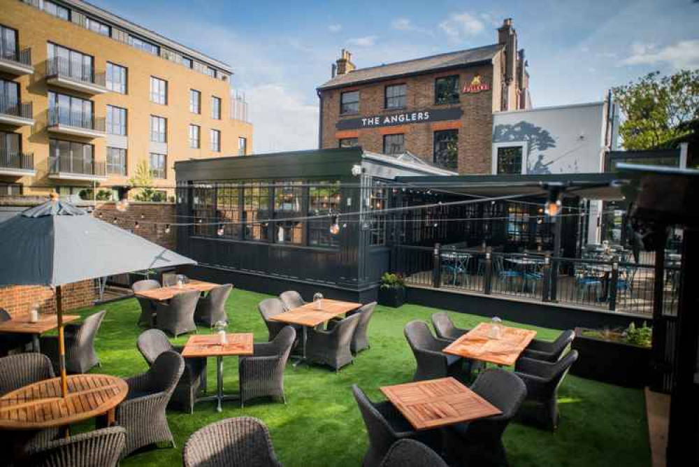 Extensive outdoor seating at The Anglers pub near Teddington Lock