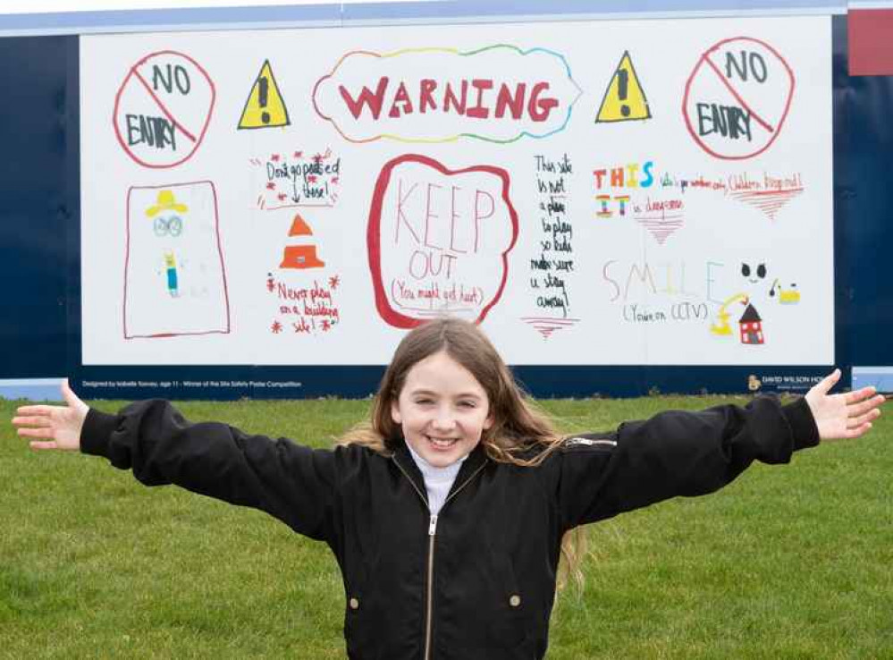 Isabelle in front of her safety banner