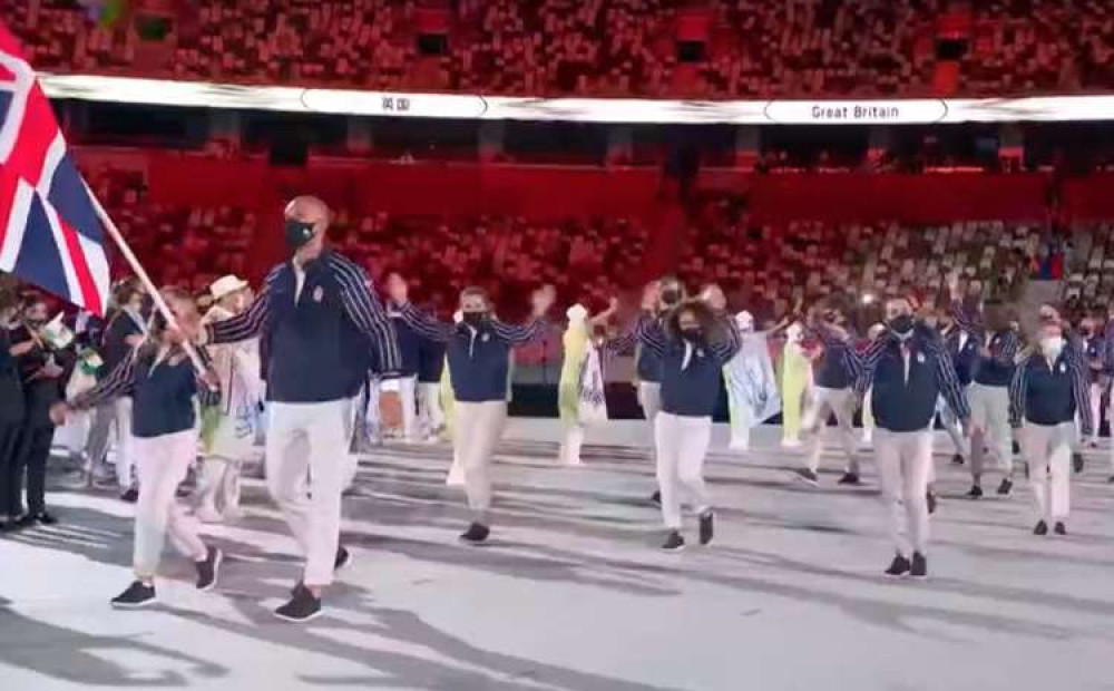 Moe is one of 10 members of the Tokyo 2020 squad who trained at the University. Pictured: leading Team GB out in the Olympic opening ceremony last week (Credit: BBC)