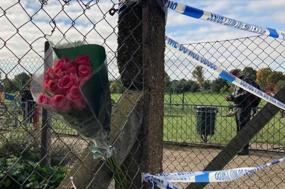 Flowers left at the crime scene in Twickenham yesterday (Image: James Mayer)