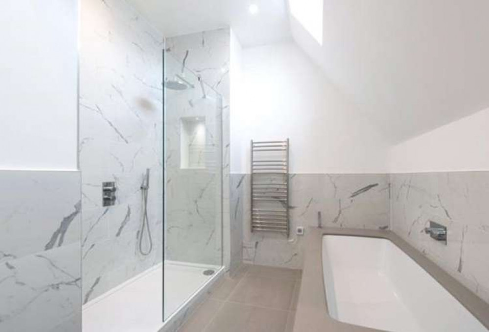 But the house has been modernised as this trendy marbled bathroom shows (Image: Hamptons)