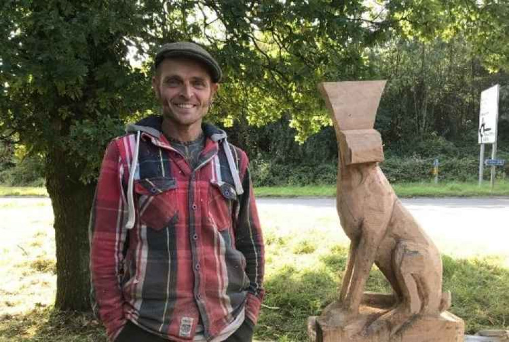 Simon with a carving of a hare he is currently working on