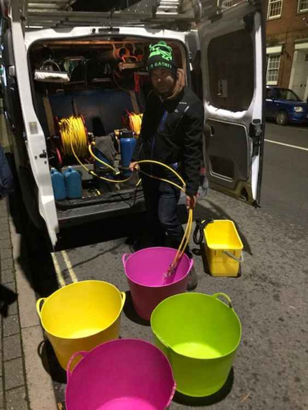 Stuart filling our buckets up with water