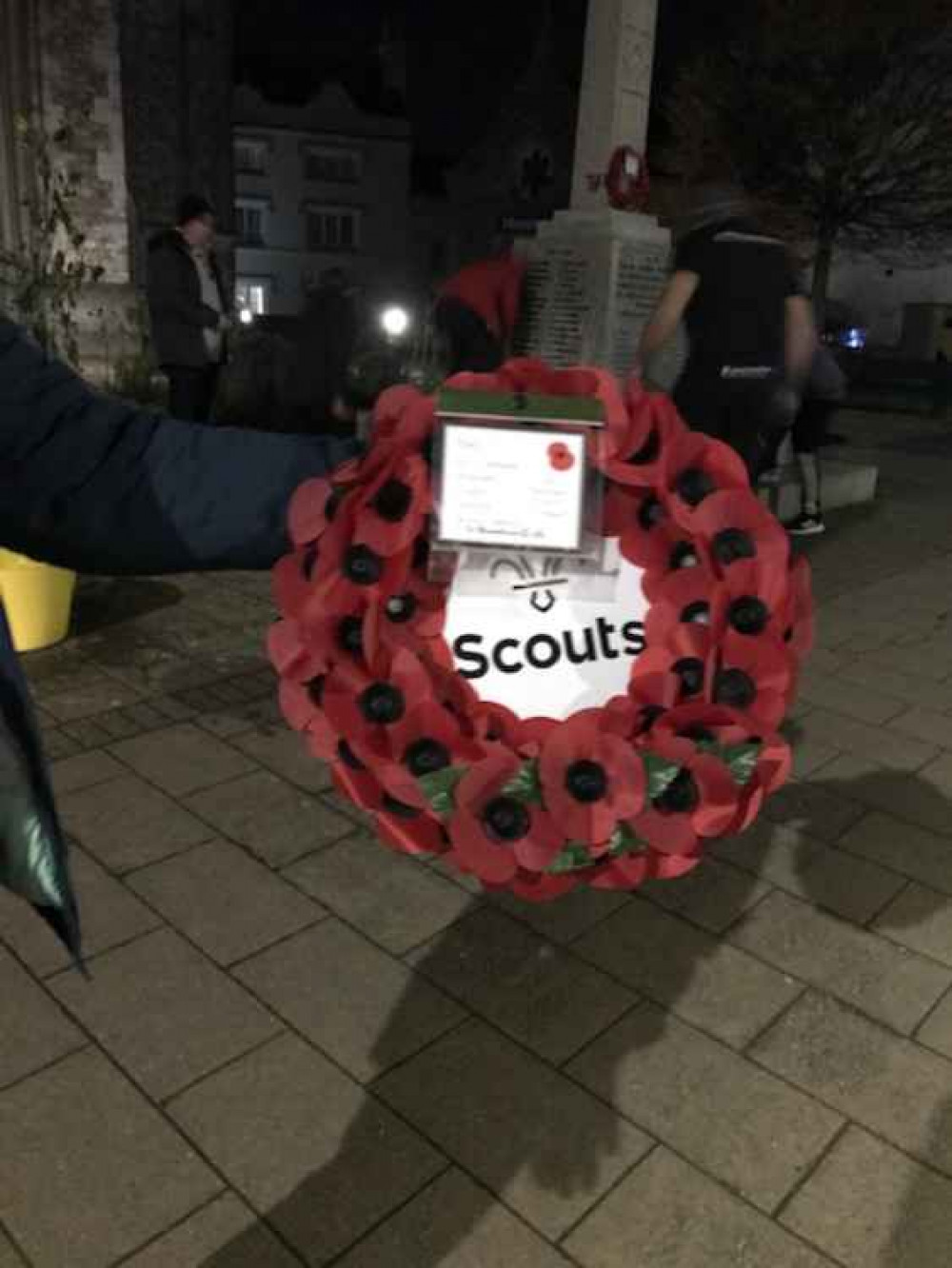 Our Poppy Wreath and Scouts cleaning the Memorial in the background