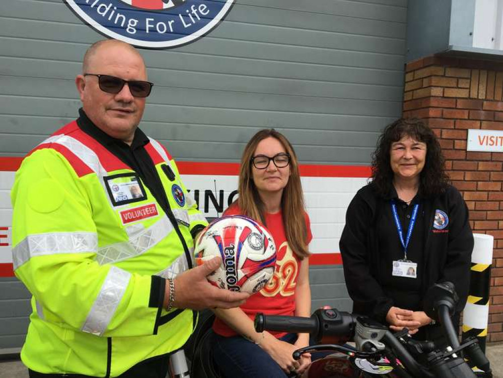 Kelly Lawson, centre, with Devon Freewheelers deputy CEO Russell Roe, and Executive Assistant, Vikki Finney, right. Photo: Devon Freewheelers