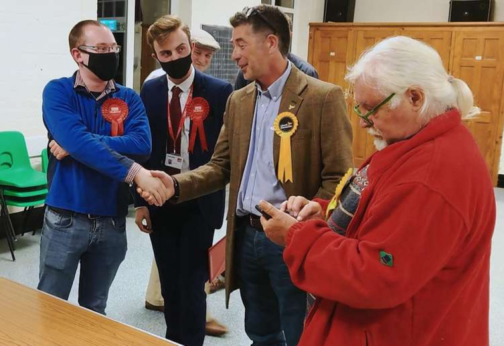 The Labour candidate Mike Daniell congratulates by-election winner Jamie Kemp. Picture: LDRS