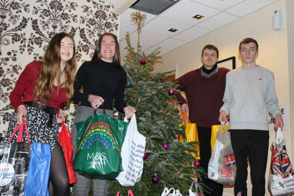 Sixth Form students with a selection of the bags they collected for Ashby Food Bank