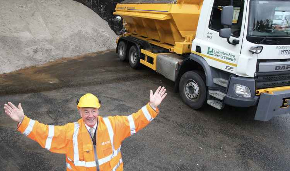 Cllr Trevor Pendleton with a county council gritter and salt stock pile - Ashby roads are being treated following the snowfall