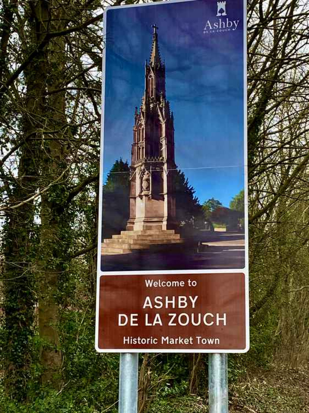 The signs welcome visitors to the town as they approach from all directions