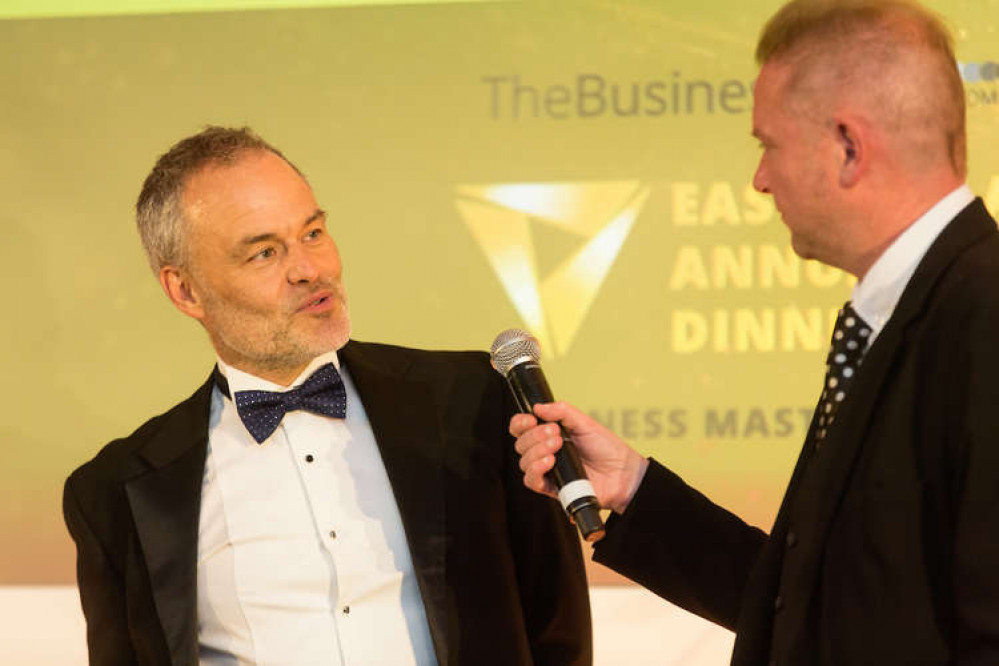 Managing Director Dom Barraclough collects the award