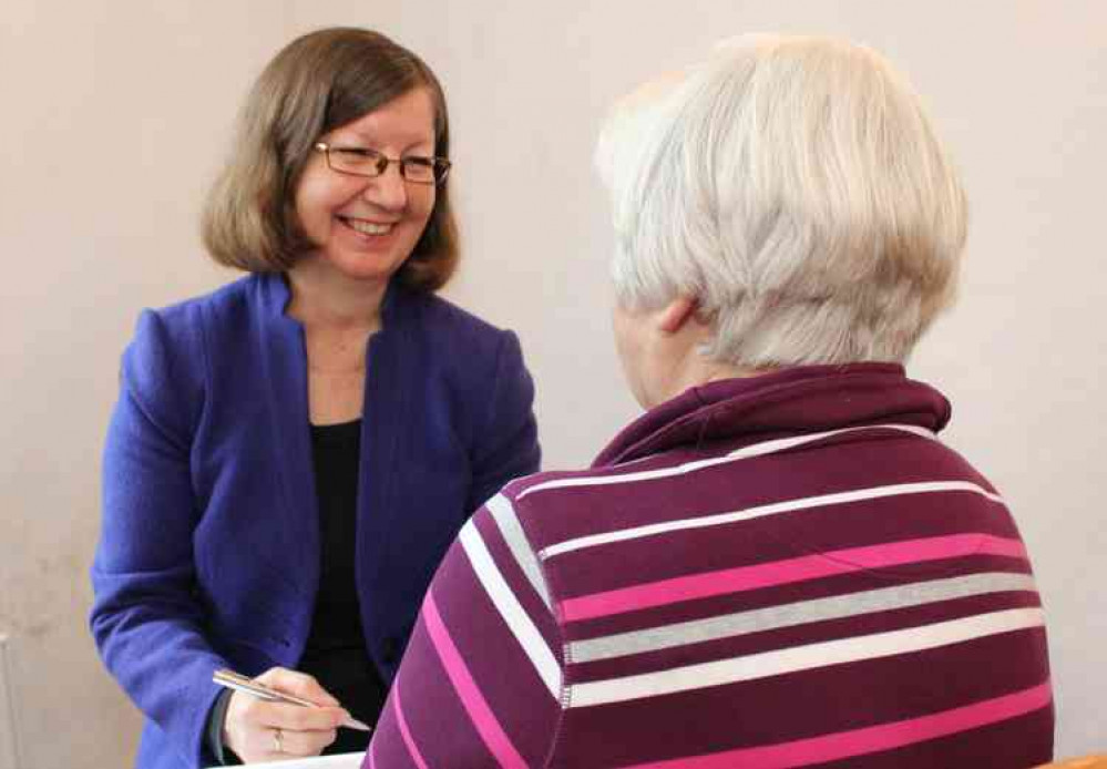 Deborah Pearce seeing a client at her Sidmouth clinic.