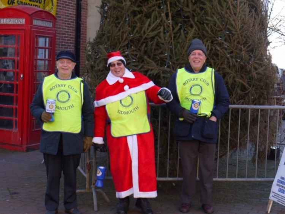 Rotarians helping collect at Christmas