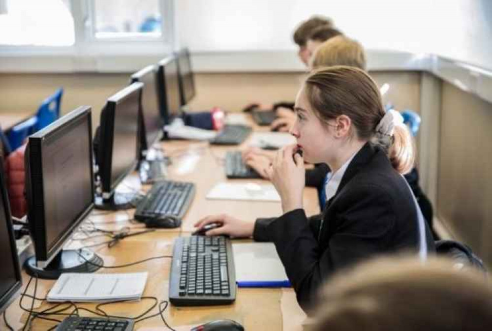 Pupils using laptops at school, by WRPhotography