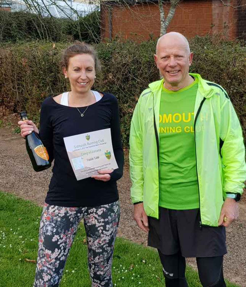 Yasmin Salter receiving her reward for running her heart around Sidmouth from Chairman Terry Bewes