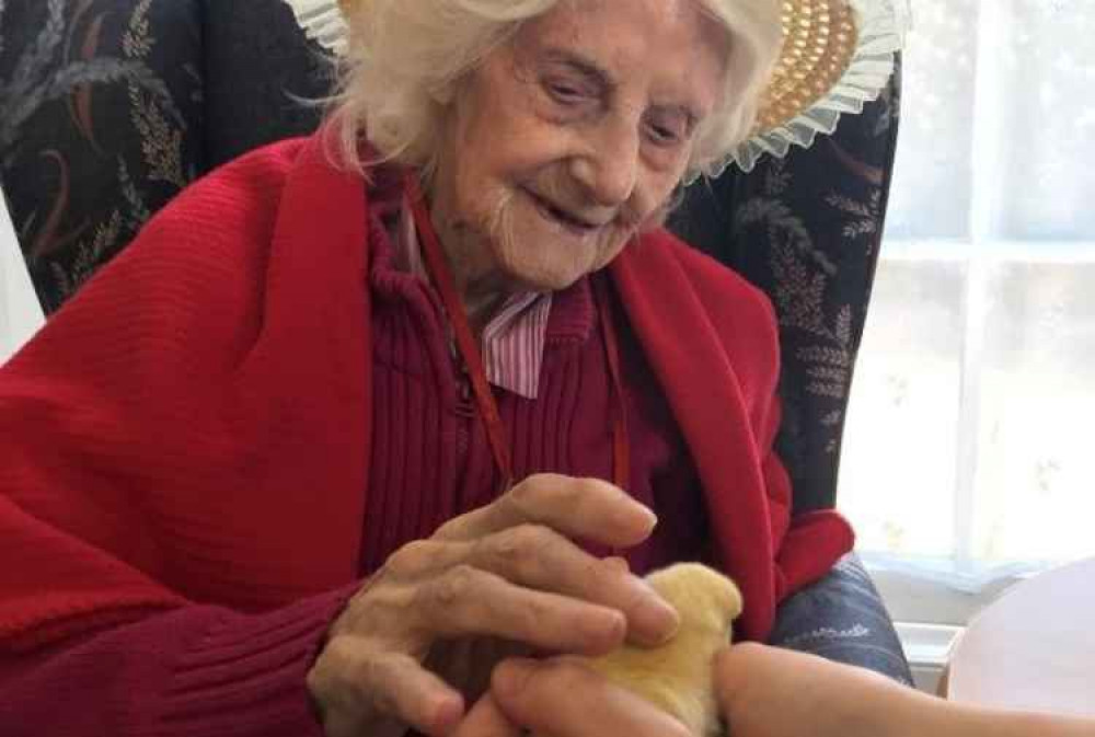 Joyce King with Easter bonnet and baby chick