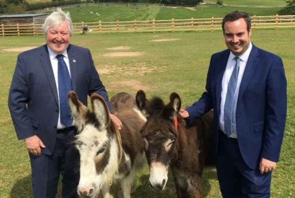 Simon Jupp MP (right) with Ian Cawsey and donkeys Drizzle and Cocoa