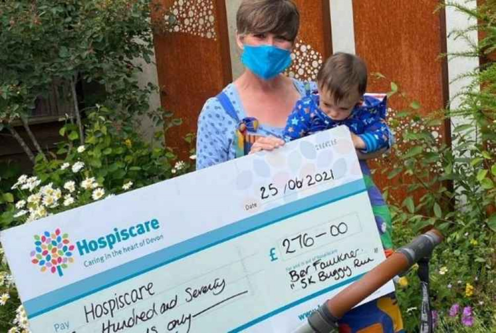 Bev Faulkner and Jesse with their cheque at King's House Day Hospice, Honiton