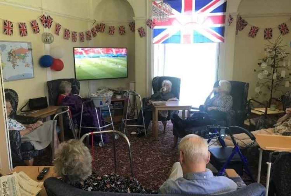 Arcot House residents watch Wimbledon in their flag-bedecked lounge