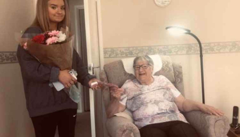 Jackie is presented with flowers from The Sparkle Foundation. Credit:  Project Lovely Jackie.