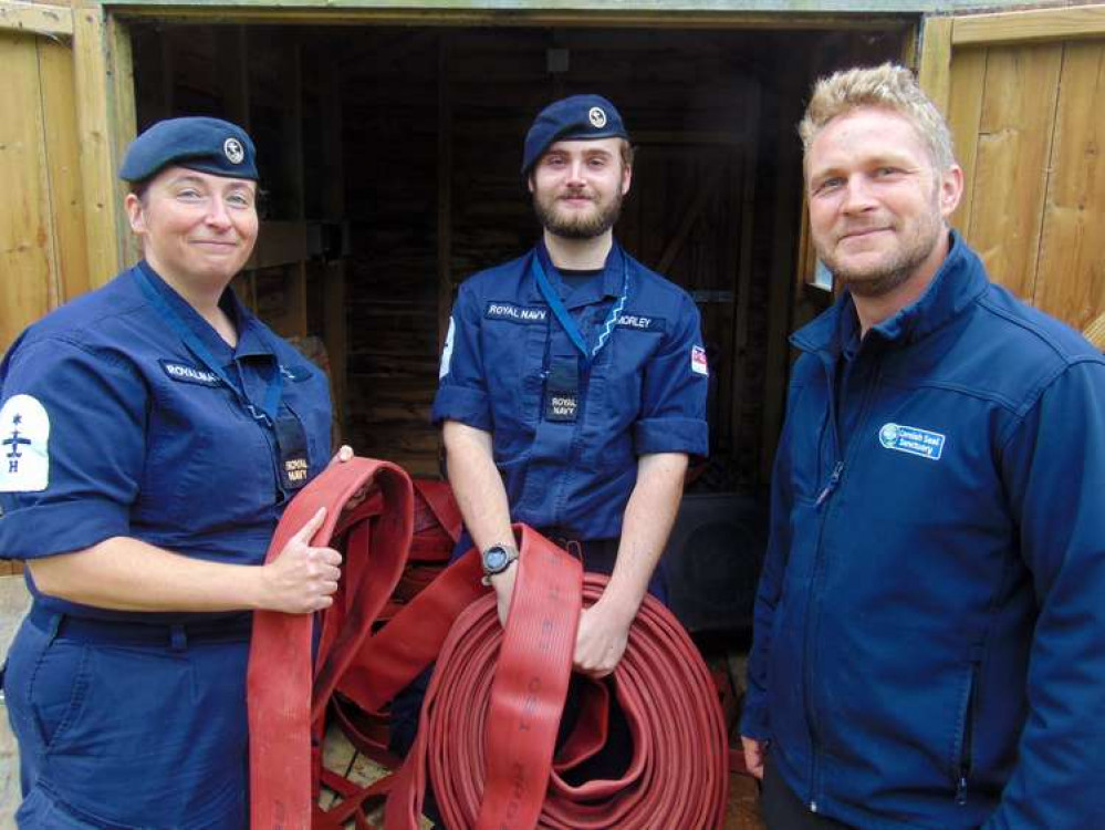 Pictured at the Cornish Seal Sanctuary are aircraft handlers able rates Emma Tatnell and Scott Morley with seal care team supervisor Ben Fowler