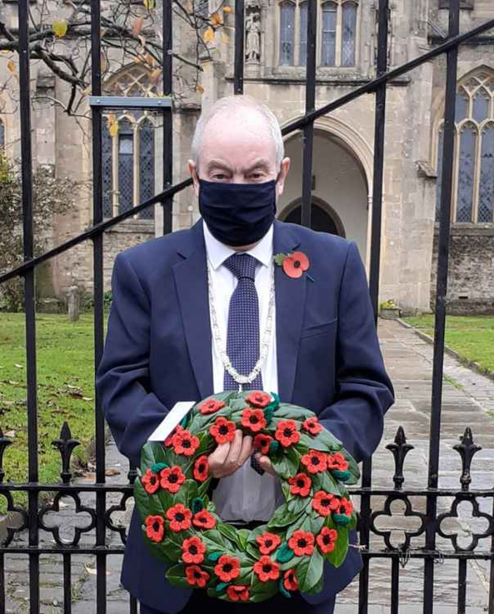 Wreath of woollen poppies laid at St John's Church, Glastonbury, by Cllr Nick Cottle, deputy chair of Mendip District Council