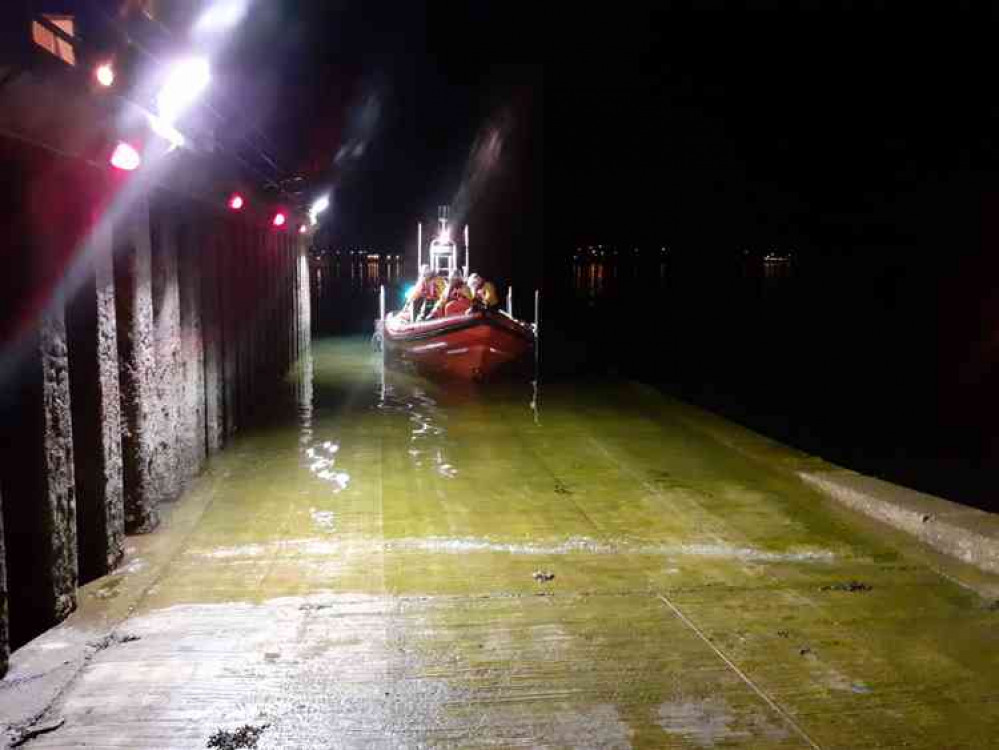 Image shows the volunteer crew and inshore lifeboat heading out to the rescue (Falmouth RNLI) Image shows the volunteer crew and inshore lifeboat heading out to the rescue (Falmouth RNLI)