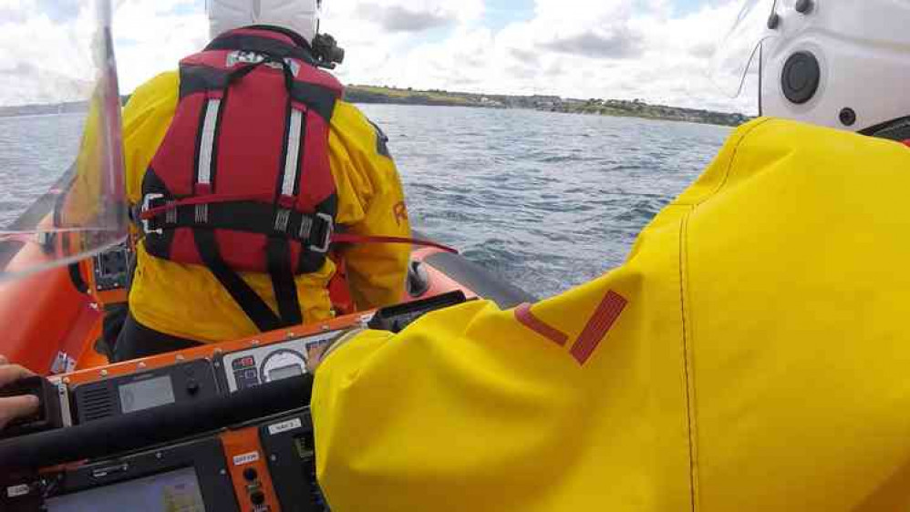 Inshore lifeboat Robina Nixon Chard travelling to and from the shout across the bay.