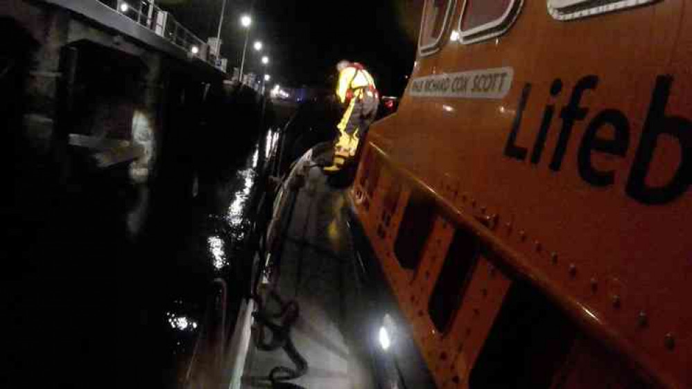 Falmouth all-weather lifeboat crew attending first shout in Falmouth harbour. Falmouth all-weather lifeboat crew attending first shout in Falmouth harbour.
