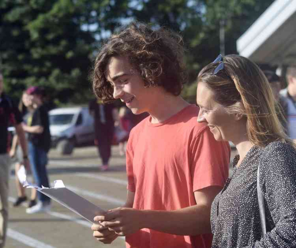 Former Head Boy, Sebastien Gentile, shares his exam results with his mother Former Head Boy, Sebastien Gentile, shares his exam results with his mother