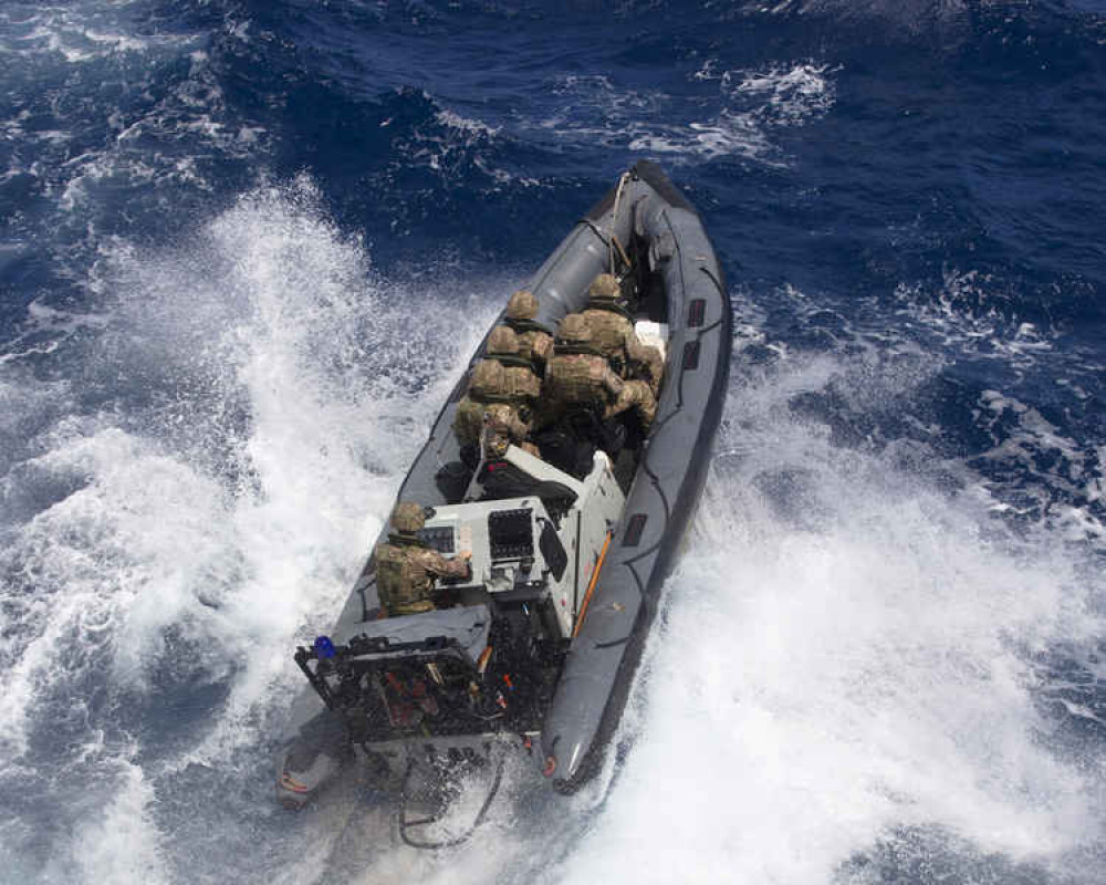 A specialist team heads out to intercept the drug runners. Credit: Royal Navy.