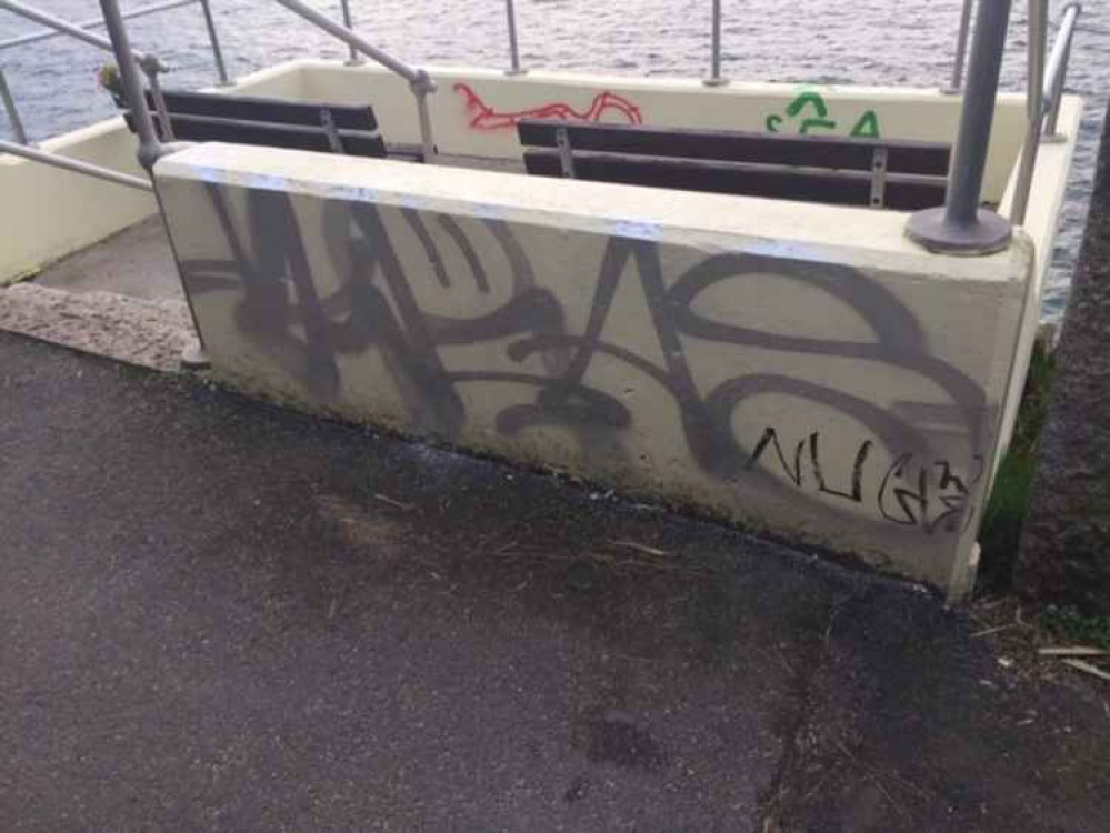 The graffiti along the seafront on Cliff Road.