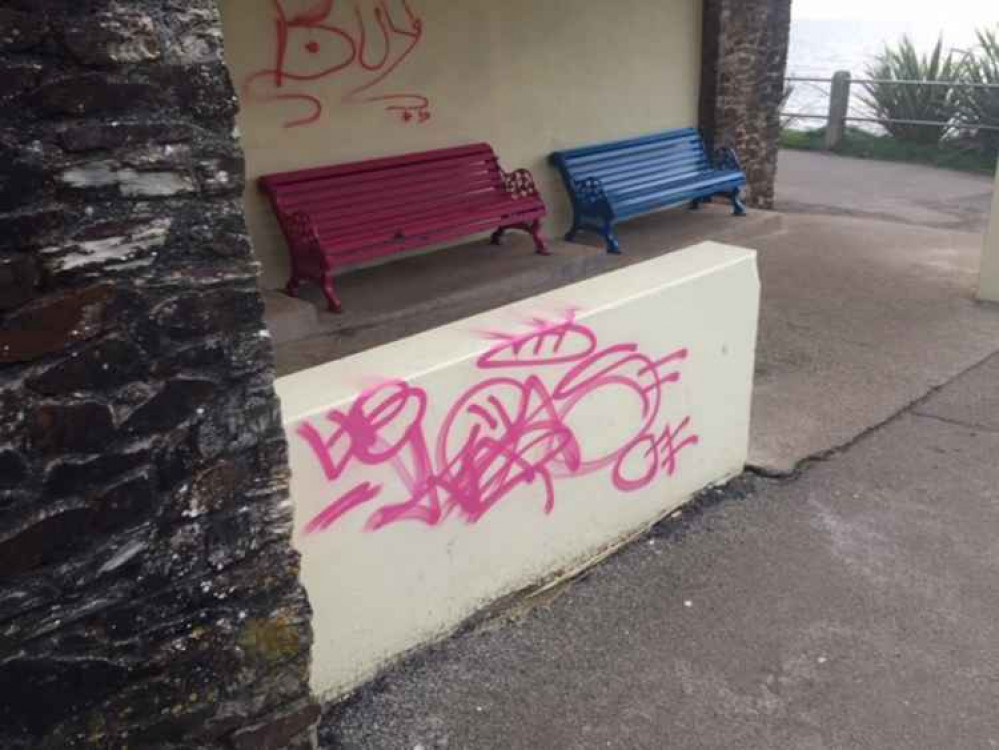 The graffiti along the seafront on Cliff Road.