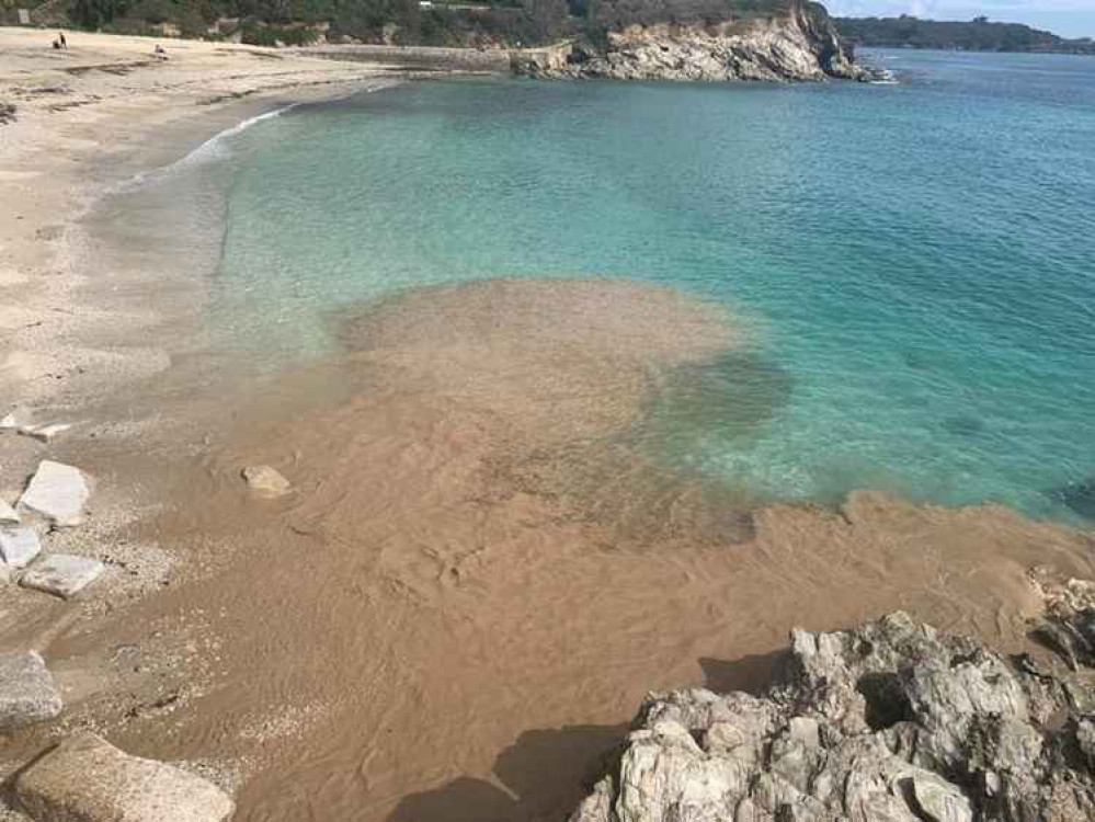 The waste running out into the sea at Swanpool.