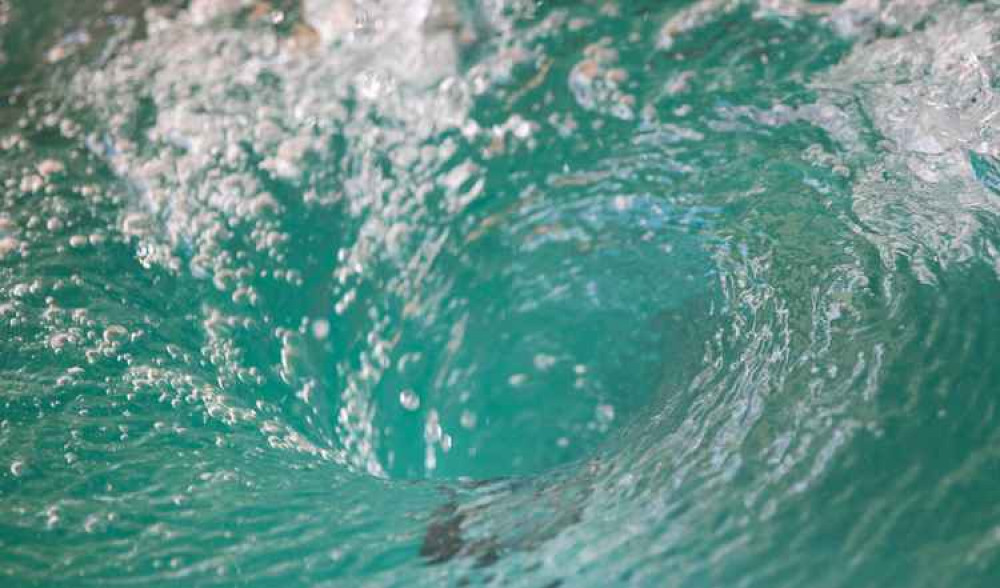 The swimmers had to be rescued by local surfers.