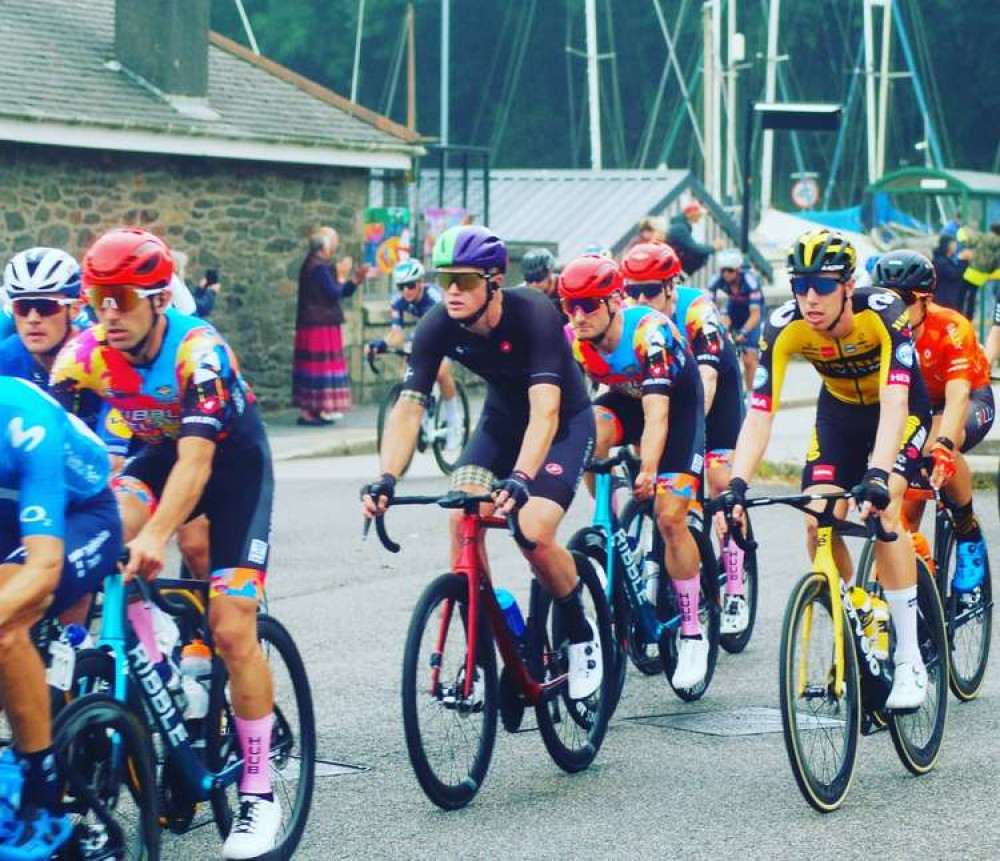 Photo of the cyclists going through Penryn, taken by Christopher Thom. (Click the arrow to scroll across).