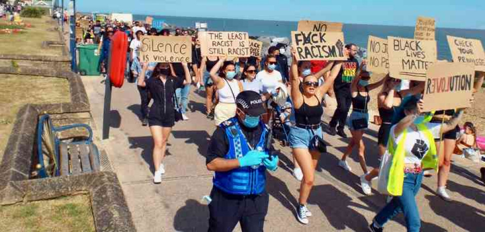 A police officer escorted the marchers all the way after being at the rally