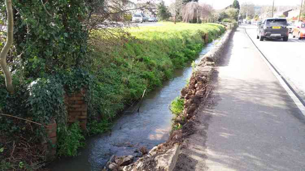 Caption; Damaged retaining wall a risk to pedestrians