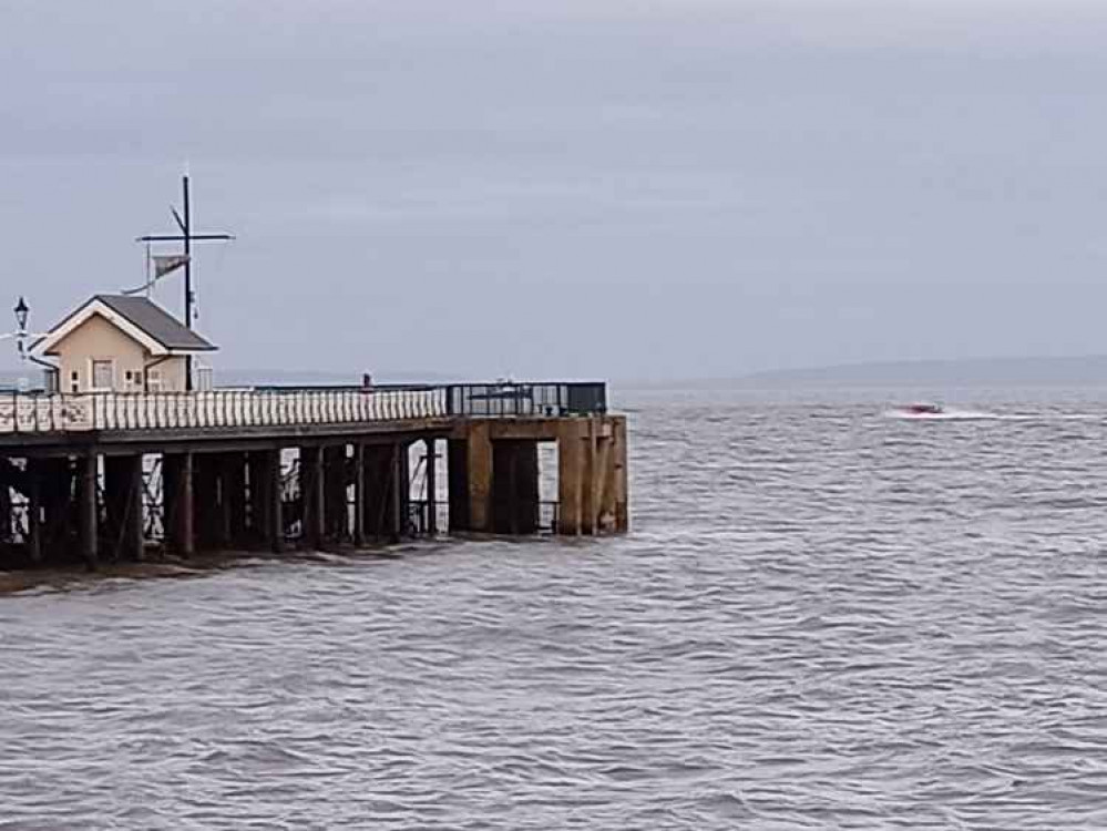 The lifeboat passing the pier on its way to the callout