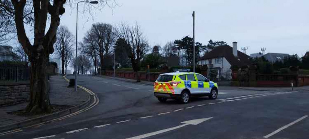 A police car was also temporarily parked at Cliff Parade