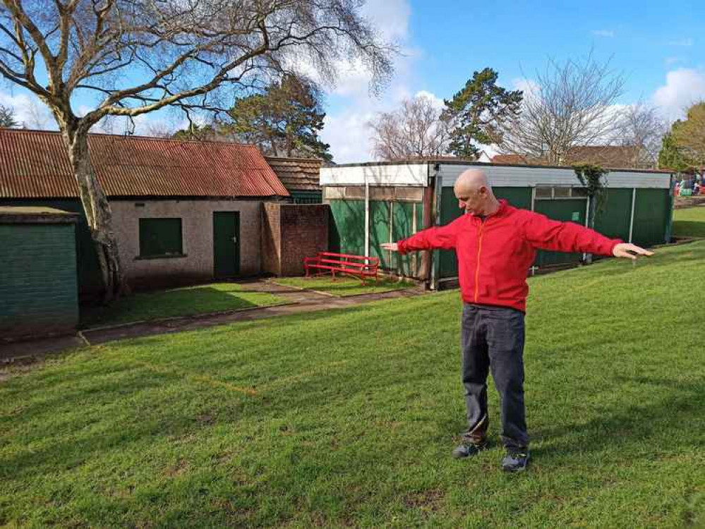 Resident Ken Gray stretches out to show the extended floorplan plus slope bank