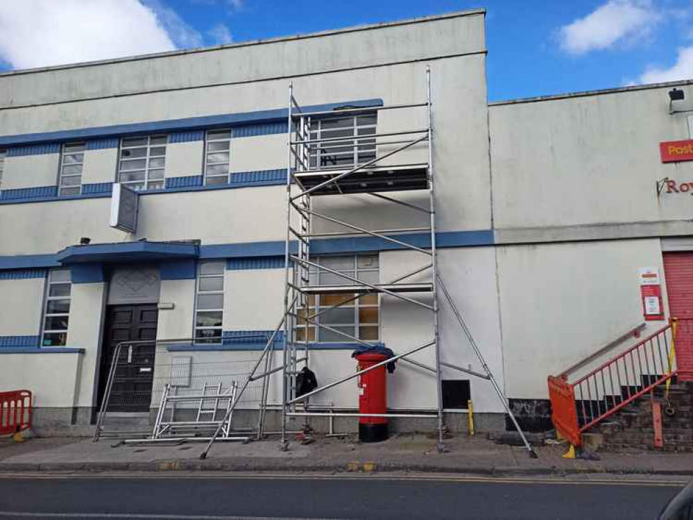 Contractors hired by Royal Mail set up scaffolding and fixed the failed render