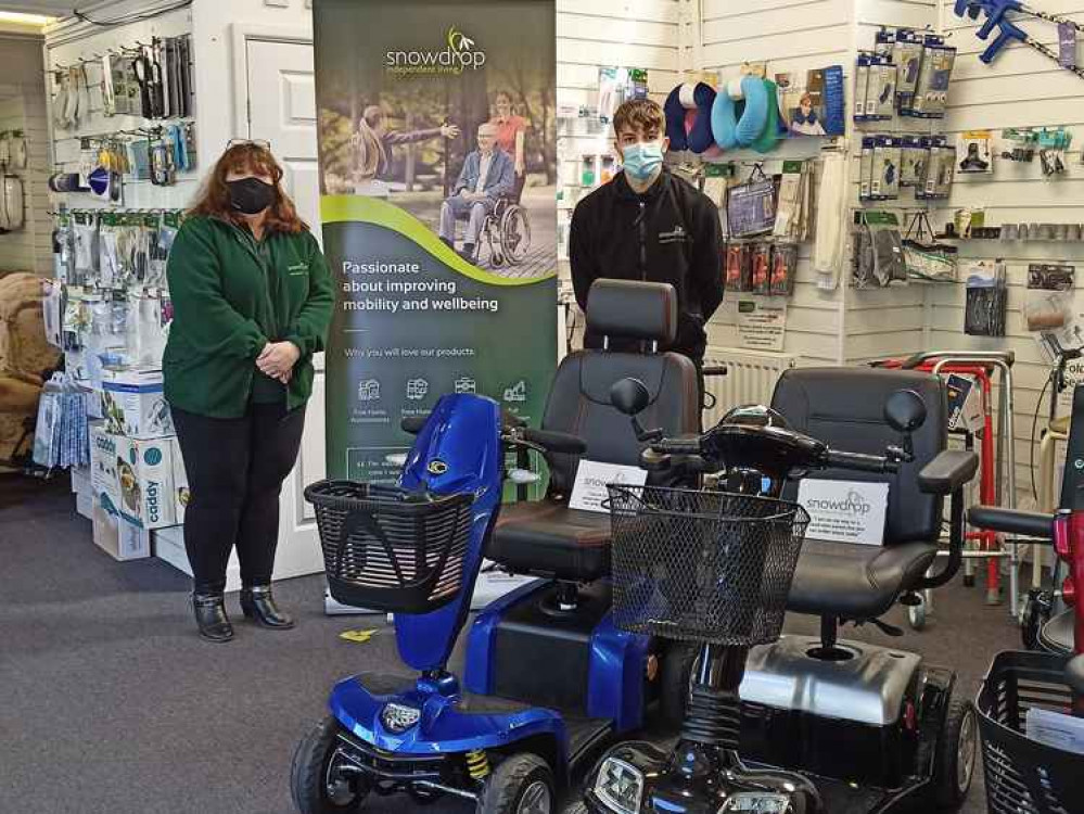 Lynne, Elliot and part of Snowdrop's range of mobility scooters