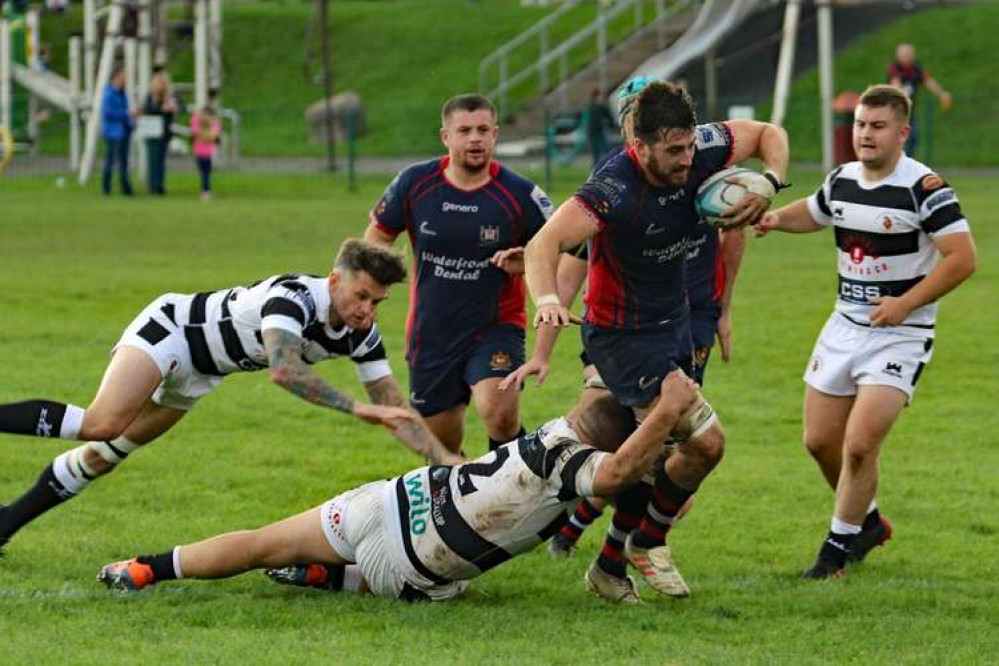 Alex Thau heads for the line as Harry Wood looks on Alex Thau heads for the line as Harry Wood looks on