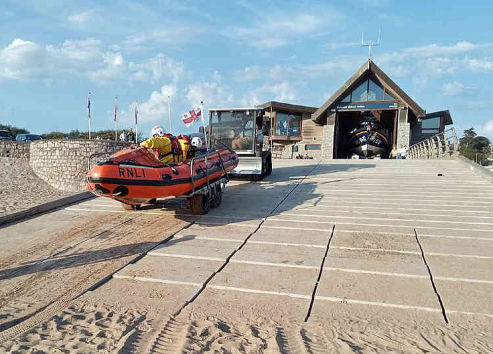 RNLI Inshore Lifeboat George Bearman II launches to the rescue. Picture courtesy of John Thorogood / Exmouth RNLI.