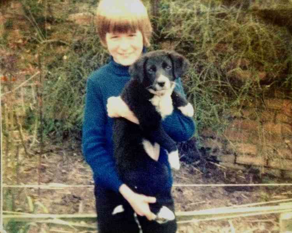 A young Paul with his childhood dog, Tess.