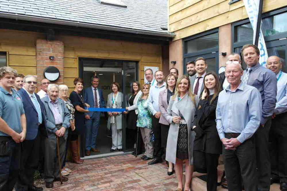 Cutting the ribbon – Councillor Megan Armstrong, EDDC's portfolio holder for Sustainable Homes and Communities opens the new office for Ian Williams Ltd. Cutting the ribbon – Councillor Megan Armstrong, EDDC's portfolio holder for Sustainable Homes and Communities opens the new office for Ian Williams Ltd.